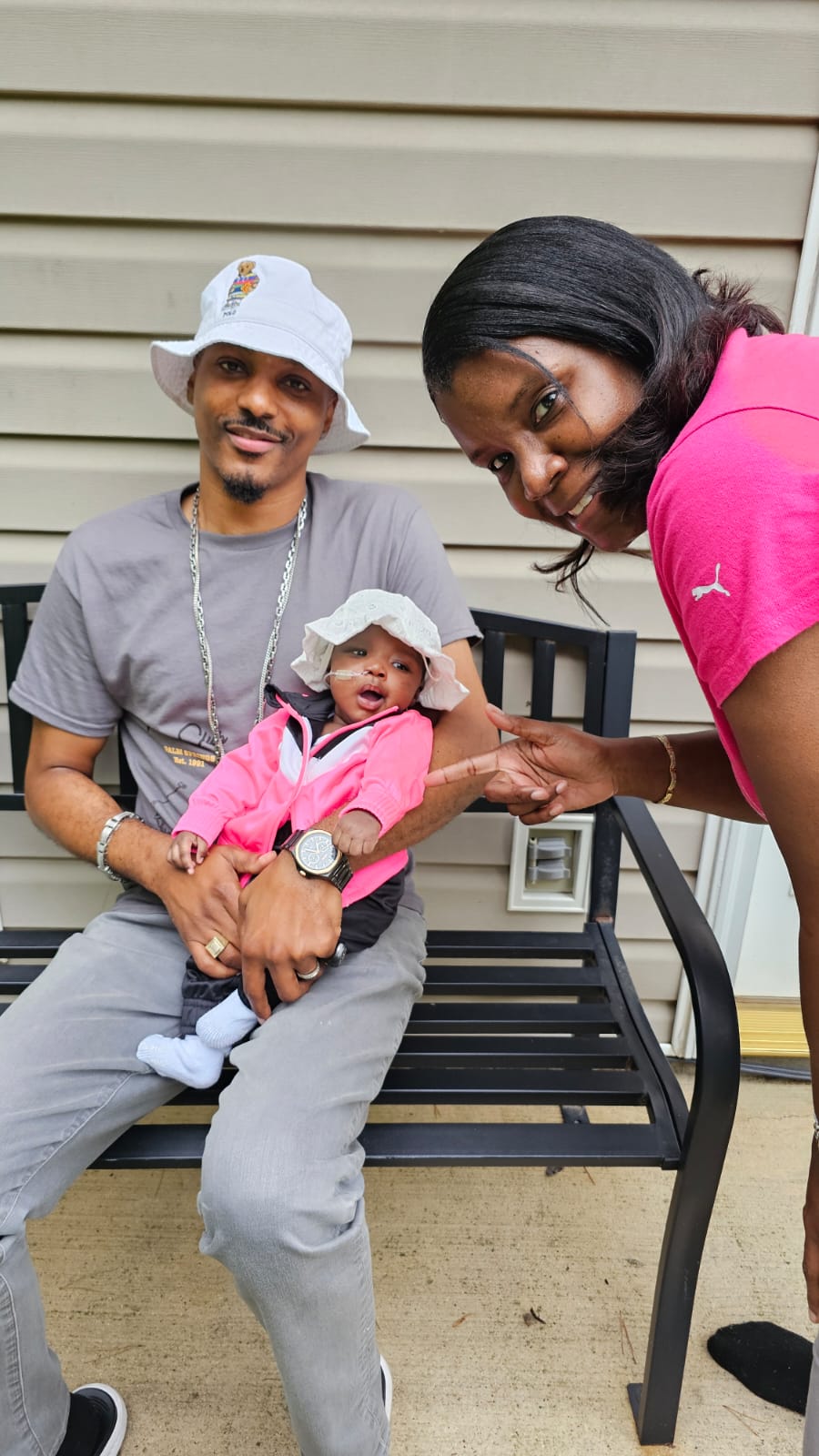 Mom lifting baby Renee joyfully at the beach