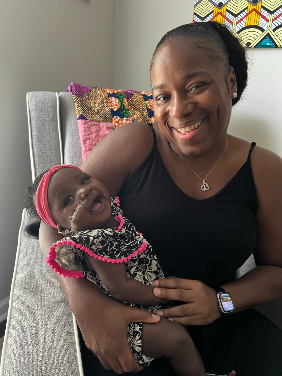 Mom and baby Renee smiling together
